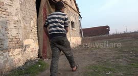FILE: Pakistani migrants hide out in abandoned castle along the Serbian Hungarian border