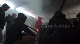 FILE: Migrants take shelter along the Serbian Croatian border