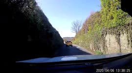 Husband pretending he is going to overtake a police car causes wife to panic and swear funny.