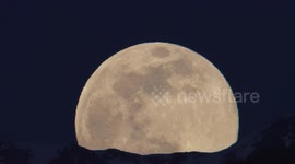 'Pink' Supermoon rises over Swiss Alps