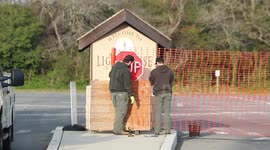 New Jersey: Park Service workers close Barnegat Lighthouse State Park by putting up orange plastic fencing as governor orders parks closed during COVID-19 pandemic