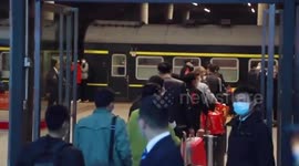 Chinese passengers queue to board first trains leaving Wuhan after COVID-19 lockdown is lifted