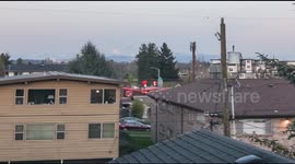 Photographer uses a deck and a ladder to film super-moon over Seattle