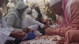 Muslims Eating Dates And Bread Together After Praying (Salat) In Nabawi Mosque Medina Saudi Arabia