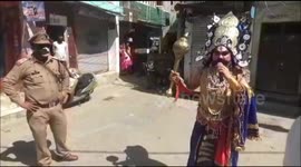Cops hire theatre artists who dress themselves as 'God Of Death' to spread awareness among the residents in Northern India