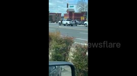 Two men hold up traffic as they fight on busy intersection in California