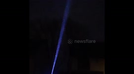 Laser light projection on to large electrical Pylon in Cardiff.