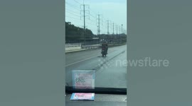 Motorcycle rider loses balance and swerves into motorway barrier