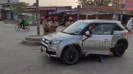 Indian police confront man flouting social distancing rules in car