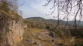 Extreme Walks: walking on the edge of the old quarry railway incline at the National Stone Centre, Derbyshire Dales, UK
