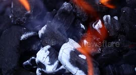 Satisfying slow-motion footage of charcoal fire
