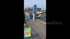 'Dinosaurs need to shop for the essentials!' UK man wears inflatable DINO suit to protect against COVID-19