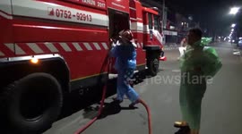 Indonesian firefighters spray disinfectant on markets in overnight operation