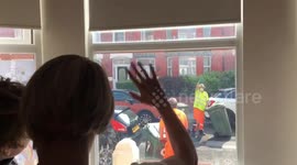 Three year old waves to the bin men