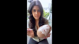 Record-setting henna artist shows off elegant design for Easter Eggs