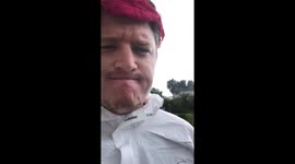 New Zealand Dad with his wife’s undies on his head uses his kids to show mum some mask options she can use while going to get groceries in Lockdown.