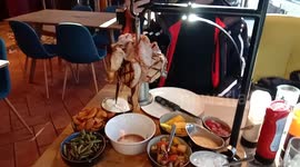 Meat is cooking on the restaurant table while eating