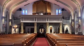 Organist plays to an empty church service due to the virus