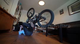 Young man riding BMX Bike in Home Office during Corona Quarantine (funny)