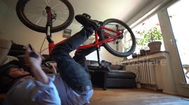Young man riding Mountainbike in Home Office during Corona Quarantine (funny)