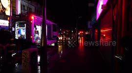 Firefighters putting out a fire in a store after the protests in Chile