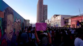 Gigantic march for women's day in Chile, women singing and dancing while displaying their banners and posters