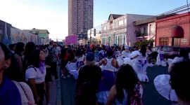 Women dancing and singing in costume on Women's Day in Chile
