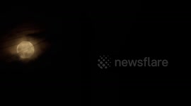 Super-moon time-lapse as it crosses the roof tops of Sunderland