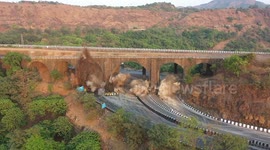 Drone captures the dramatic moment 190-year-old bridge is demolished in western India