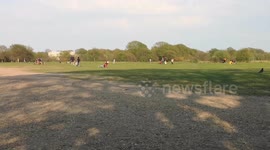 Londoners gather in park but seem to be keeping distance on Easter Monday