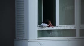 A little girl playing with a toy gun