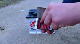 XXXL Firecracker against car battery
