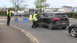 UK police turn shoppers away as B&Q customers arrive to collect their orders during COVID-19 lockdown