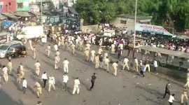 Indian police break up migrant worker demonstration outside train station during COVID-19 lockdown