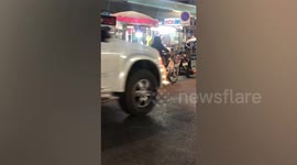 Dog jumps on motorcycle to ride home with owner