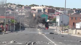 South Africans clash with police over food parcels