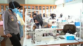 Indonesian women police were deployed to help make masks for the medical team and the community