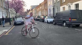 Bingo party on lockdown London street with bingo caller on bike