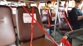 Thai bus seats blocked off with red tape to enforce COVID-19 social distancing measures