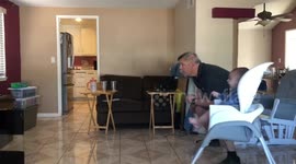 Father and baby son doing Xbox fight workout together