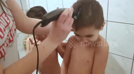 Quarantine haircut of two boys during coronavirus