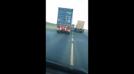 Some truckers over taking on a yellow continuous lane