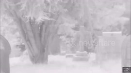 ALIEN AND SPIRIT CAPTURED IN CEMETERY ON FILM.