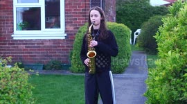 Girl in Yorkshire raises smiles with saxophone during NHS clapping