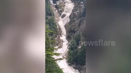 Dramatic moment avalanche strikes town and blocks highway in northern India