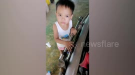 Toddler rescued after getting his finger stuck in car bumper