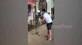 Filipino cafe sets up microphone for customers to keep safe distance amid COVID-19 pandemic
