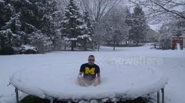 Michigan man hilariously jumps on TRAMPOLINE covered in snow