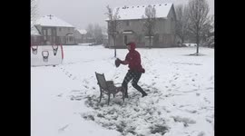 Despite coronavirus shutting down school and practice, high school quarterback continues to train in the Michigan snow