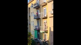 Musician performs from balcony as Italy enters week 7 of coronavirus lockdown